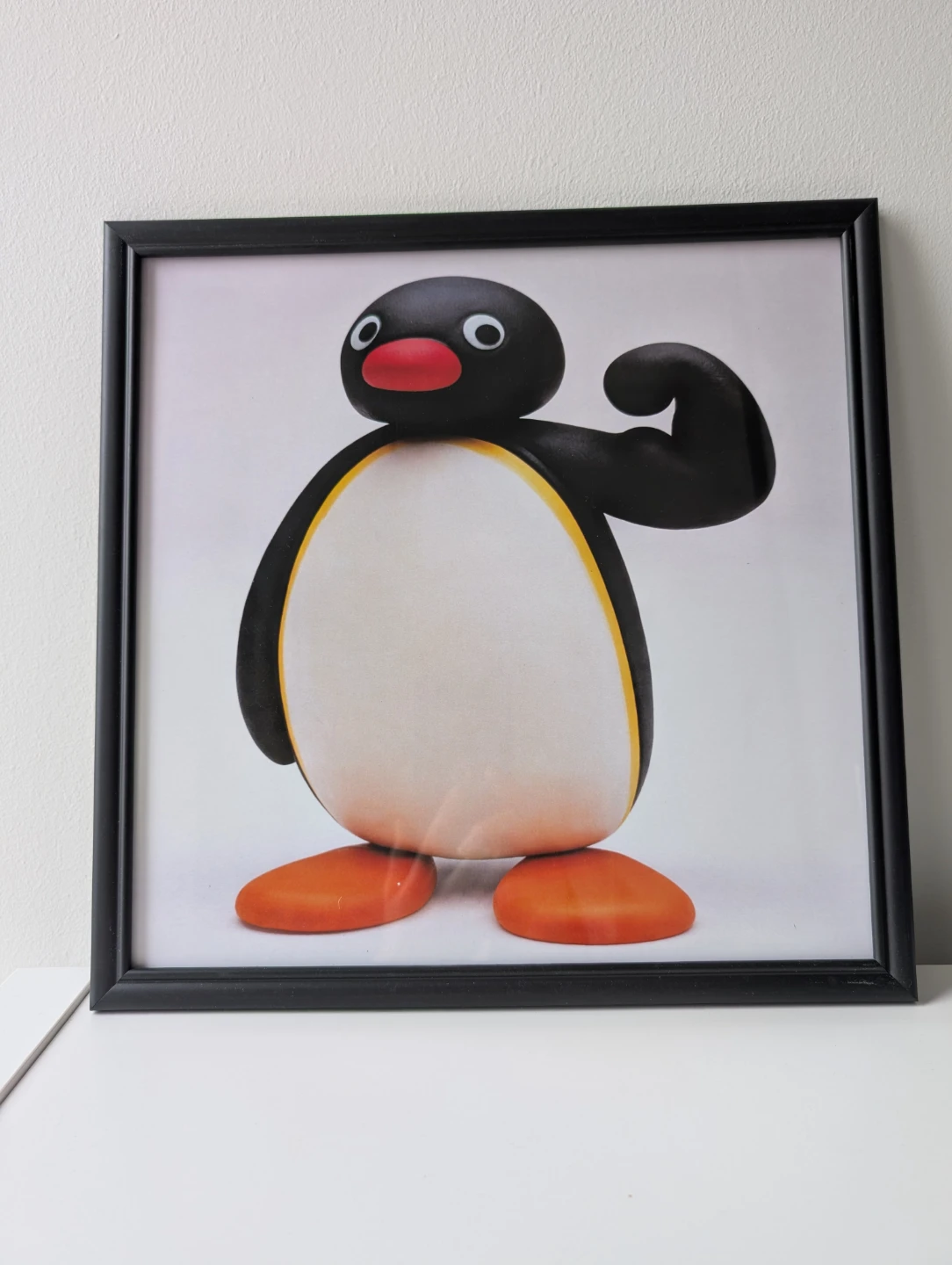 Framed Pingu flexing Print in black frame, strong penguin - photo 2