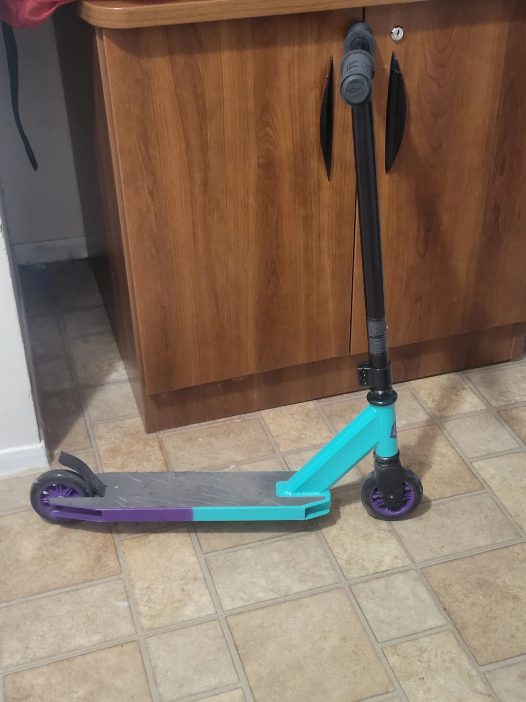 Teal and Purple Stunt Scooter