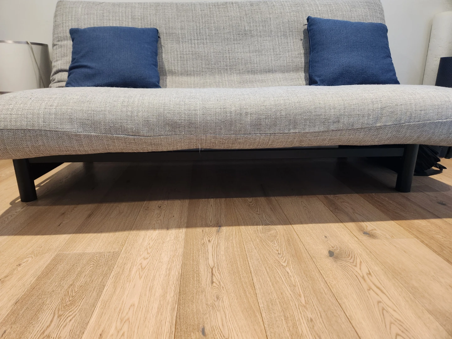 Grey futon with Two Blue Pillows - photo 2