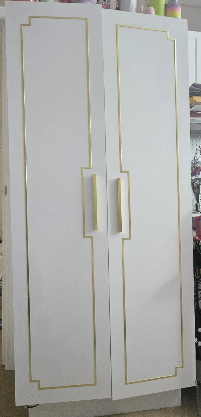 White and gold cupboard with led light