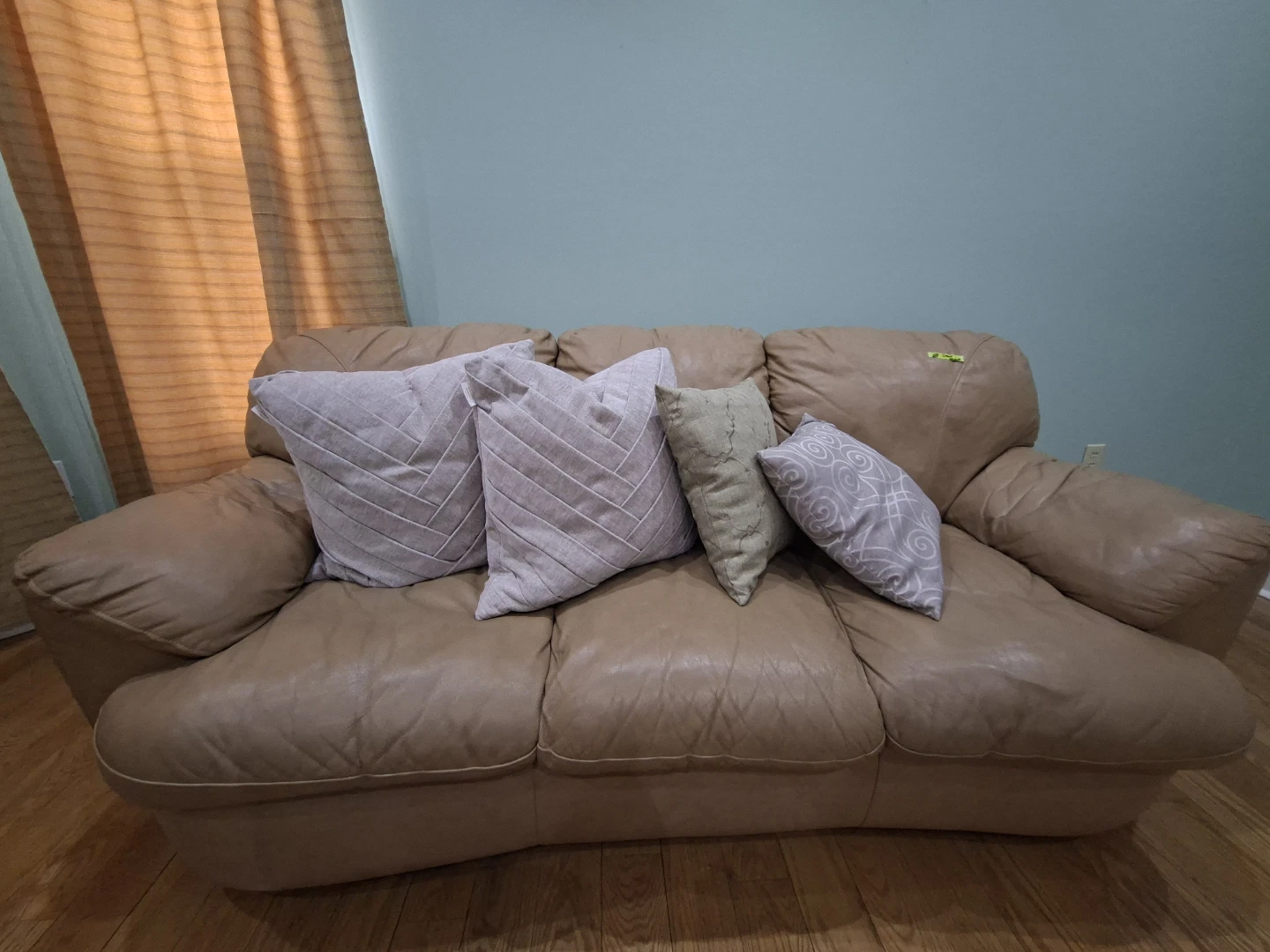 Tan Leather Sofa with Pillows