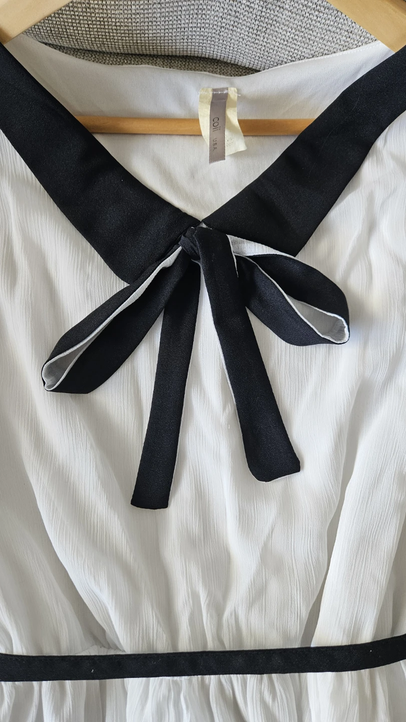 White dress with black trim and bow tie - photo 3