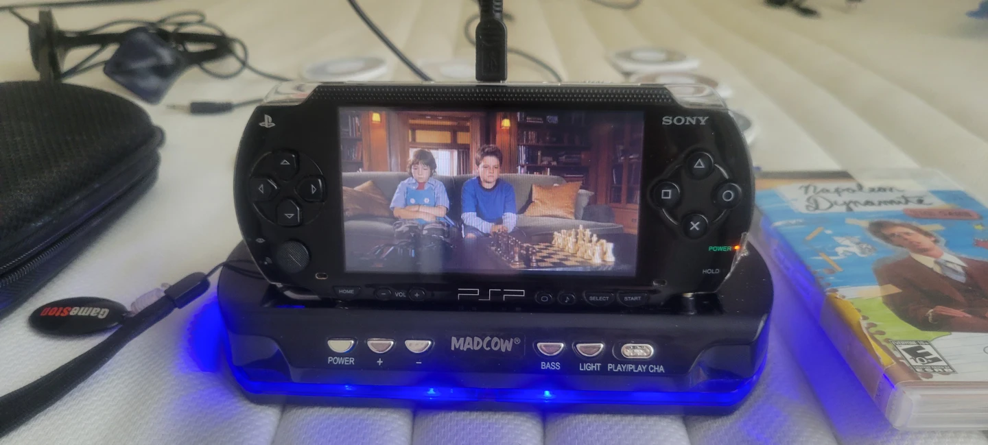 Sony PSP  with MadCatz Dock and Games - photo 2