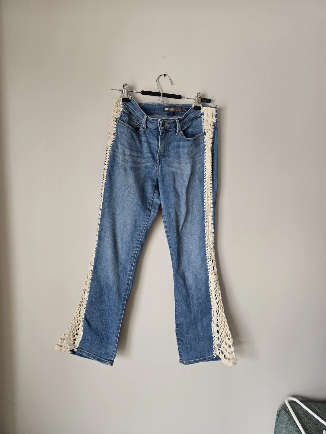 Levi's Women's Jeans with Crochet Inset, size 2/26, fits medium.