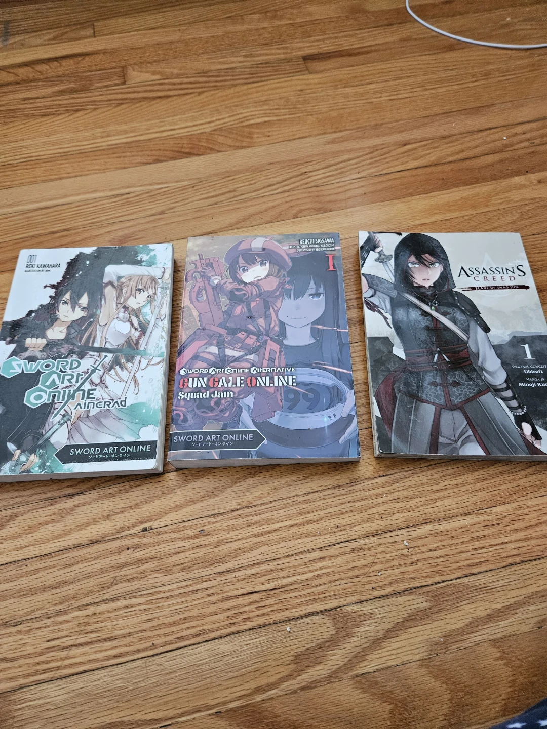 Sword Art Online & Assassin's Creed Manga Books