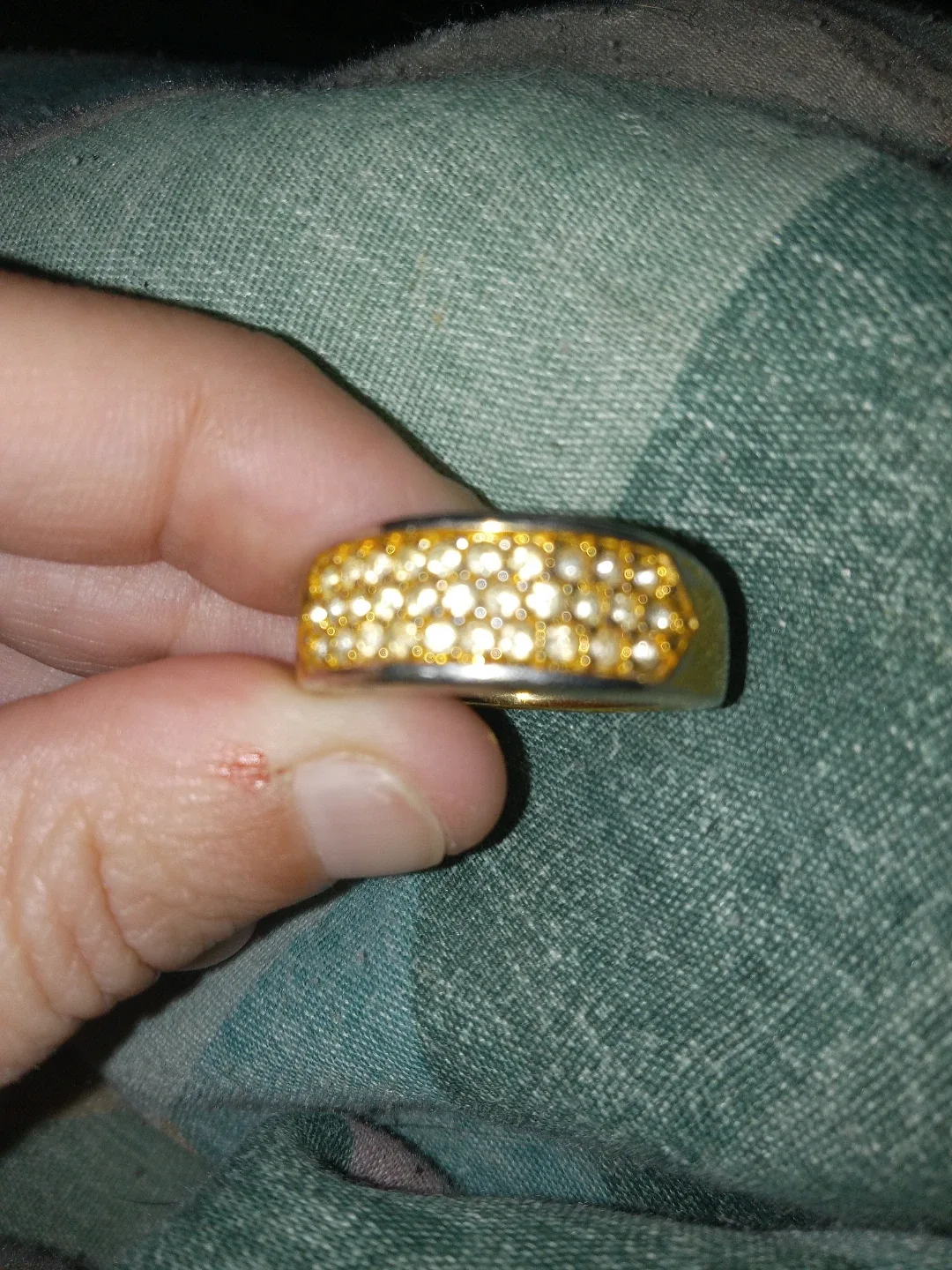 Gold-tone ring with clear stones