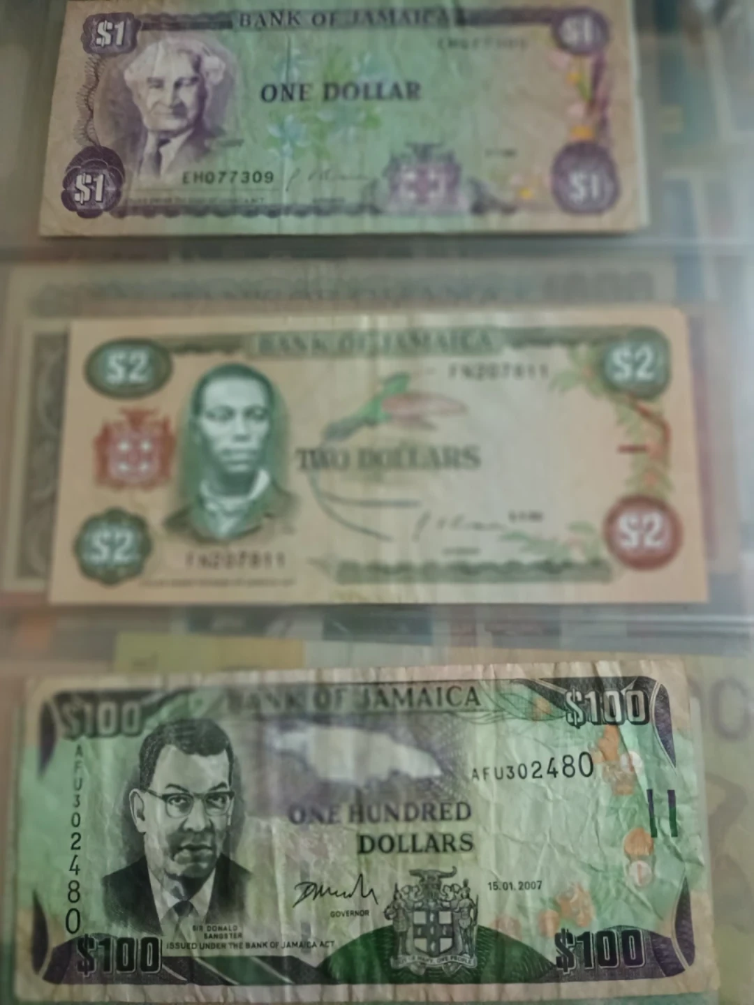 Bank of Jamaica Bills - $1, $2, and $100 - photo 4