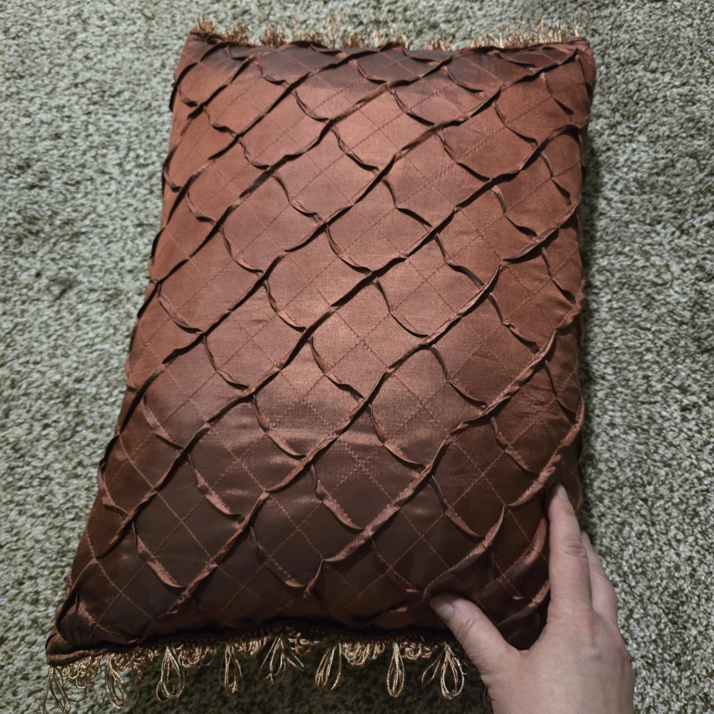 Brown decorative throw pillow with fringe