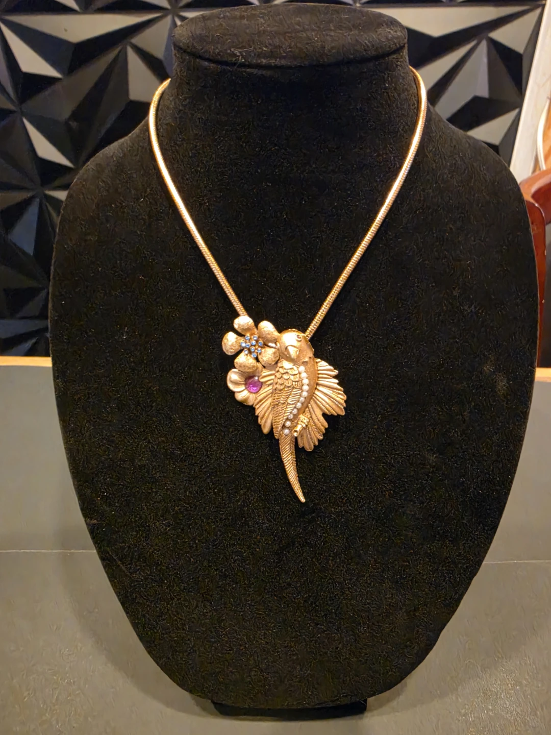 70'  Gold-tone bird and flower pendant necklace with gemstones