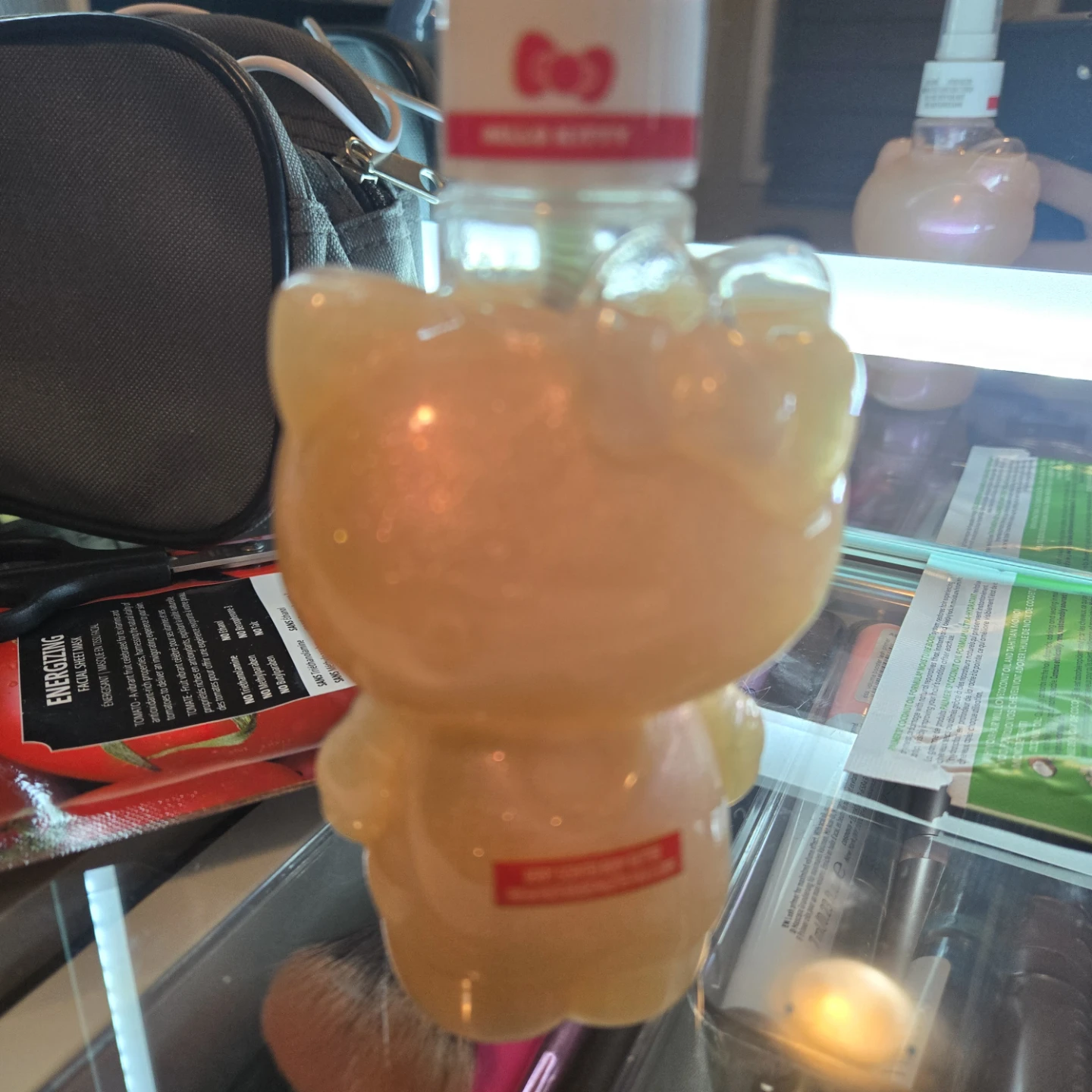 Hello Kitty shaped bottle with body glitter