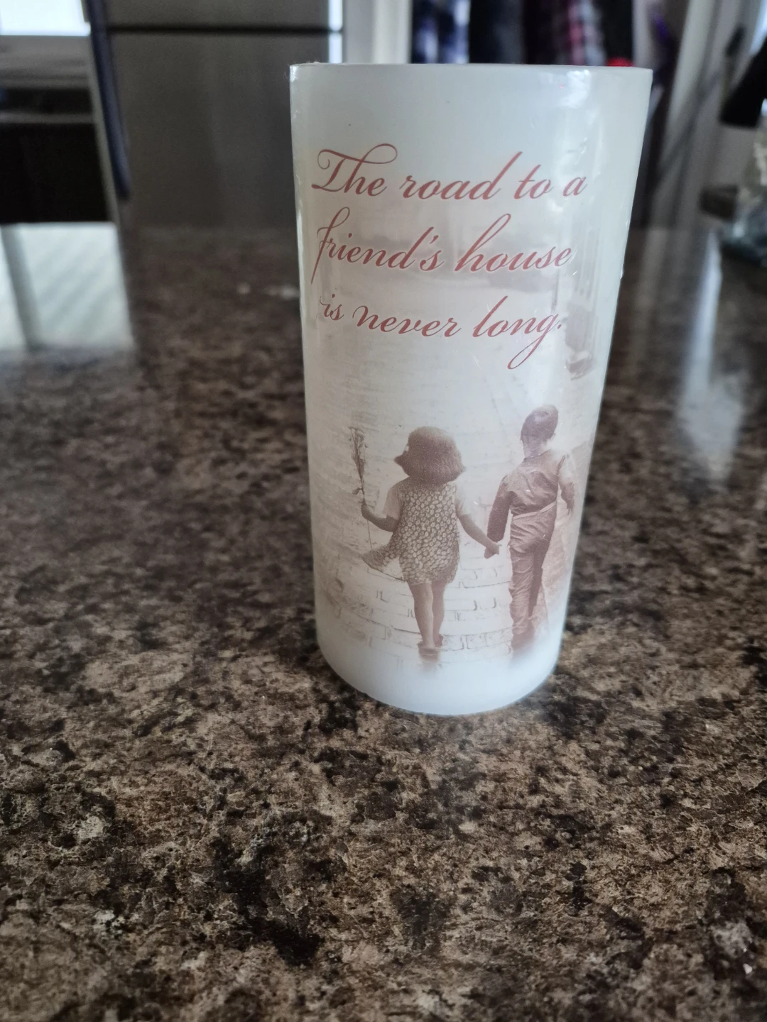 LED Candle with 'The road to a friend's house is never long'