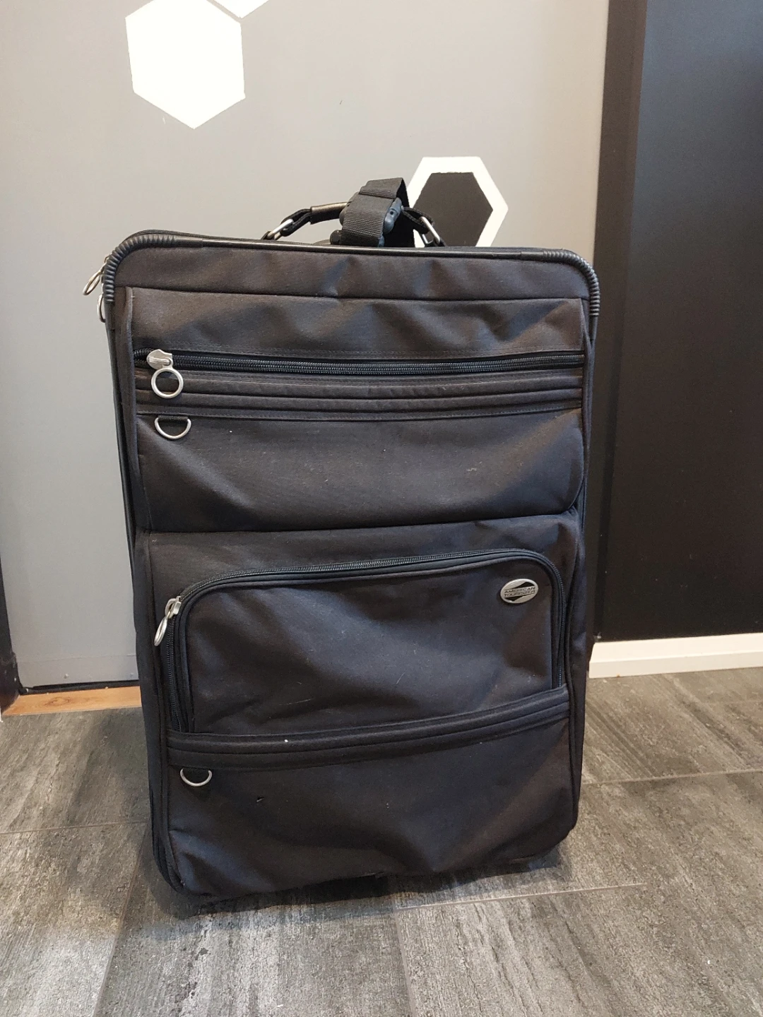 American Tourister Black Rolling Suitcase