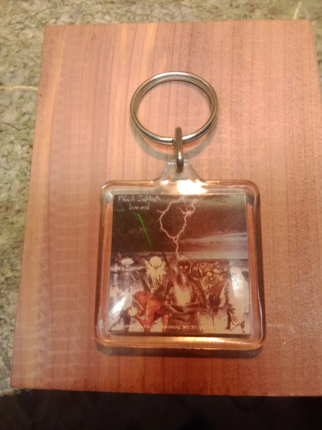 1982 very rare black Sabbath live evil key chain.