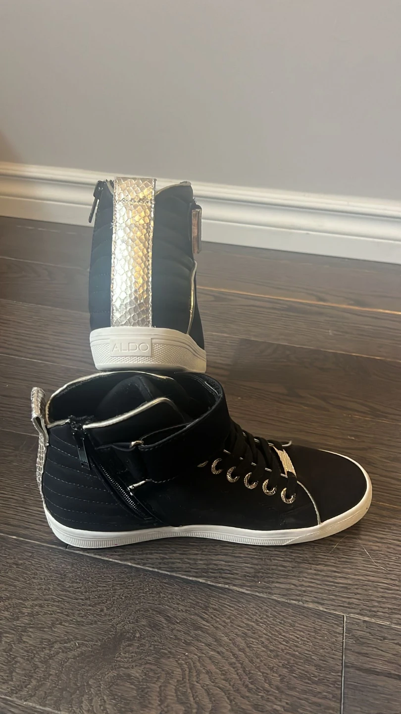 ALDO black high-top sneakers with gold accents