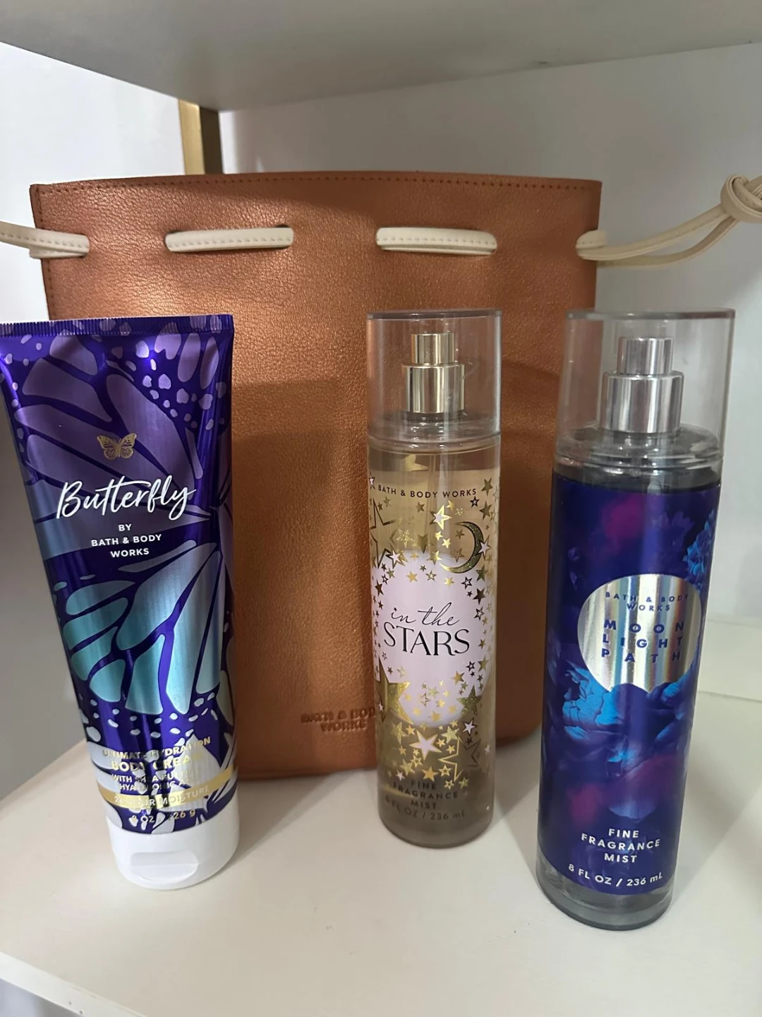 Three fragrances from Bath & Body Works, plus a bag.