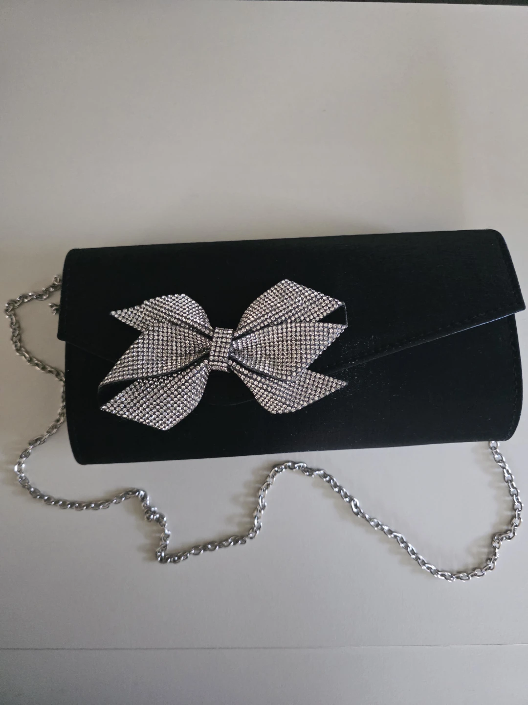 I.Miller black clutch with rhinestone bow and silver chain
