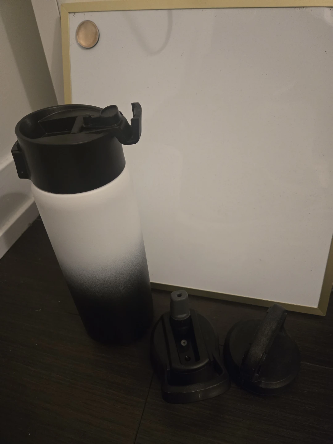 White and black gradient water bottle with two lids