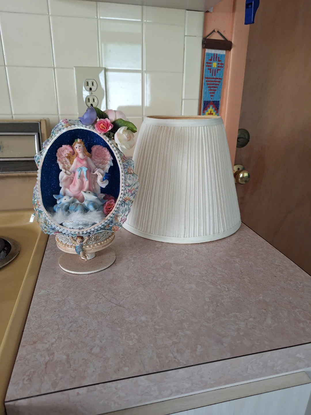 Angel with Dolphins in an Ostrich Egg