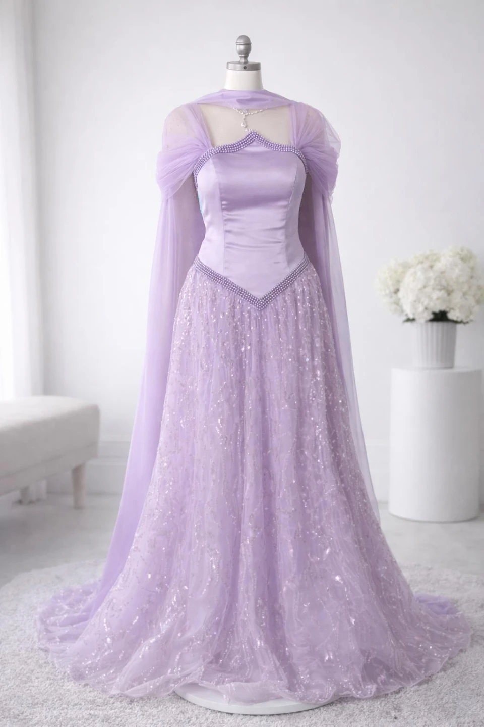 Purple sequined ball gown with cape