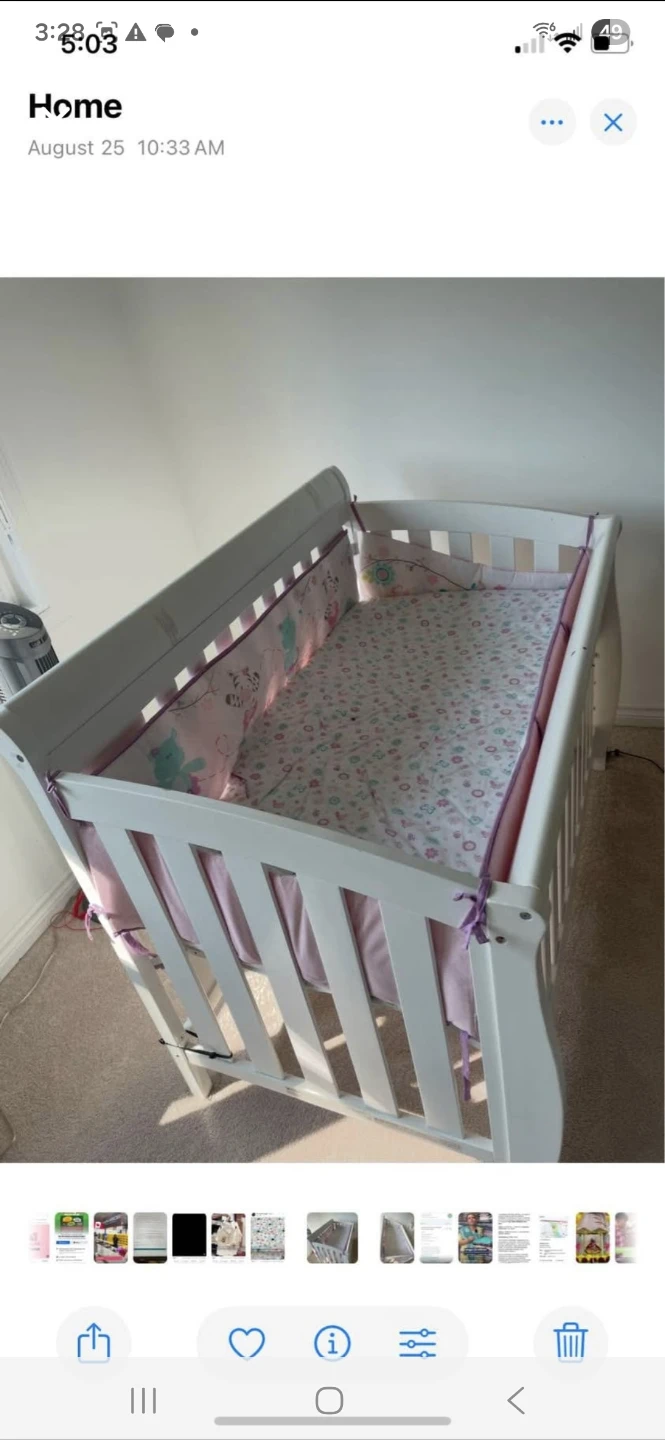 White Baby Crib with Pink and Blue Bedding