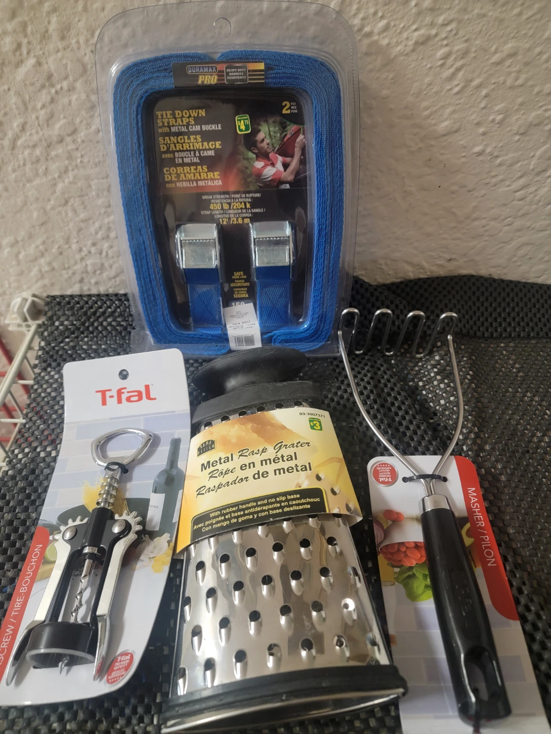 Kitchen supplies. Cheese Grater. Masher. Wine opener.