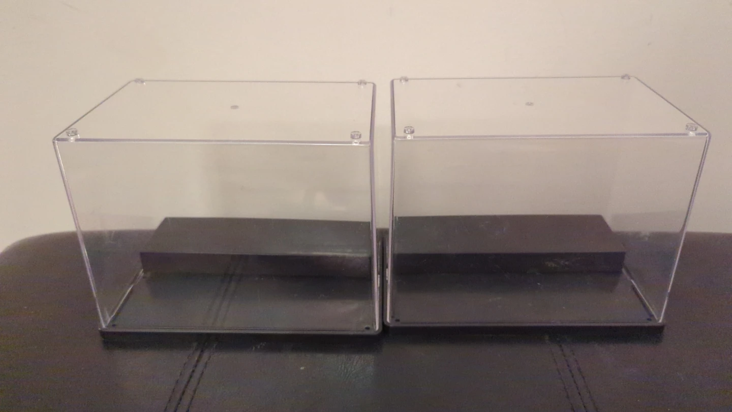 Two Clear Display Cases with Black Bases