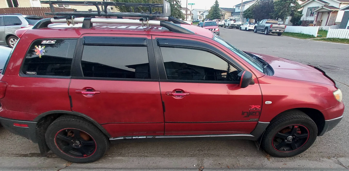 Red Mitsubishi Outlander SUV with Roof Rack - photo 3