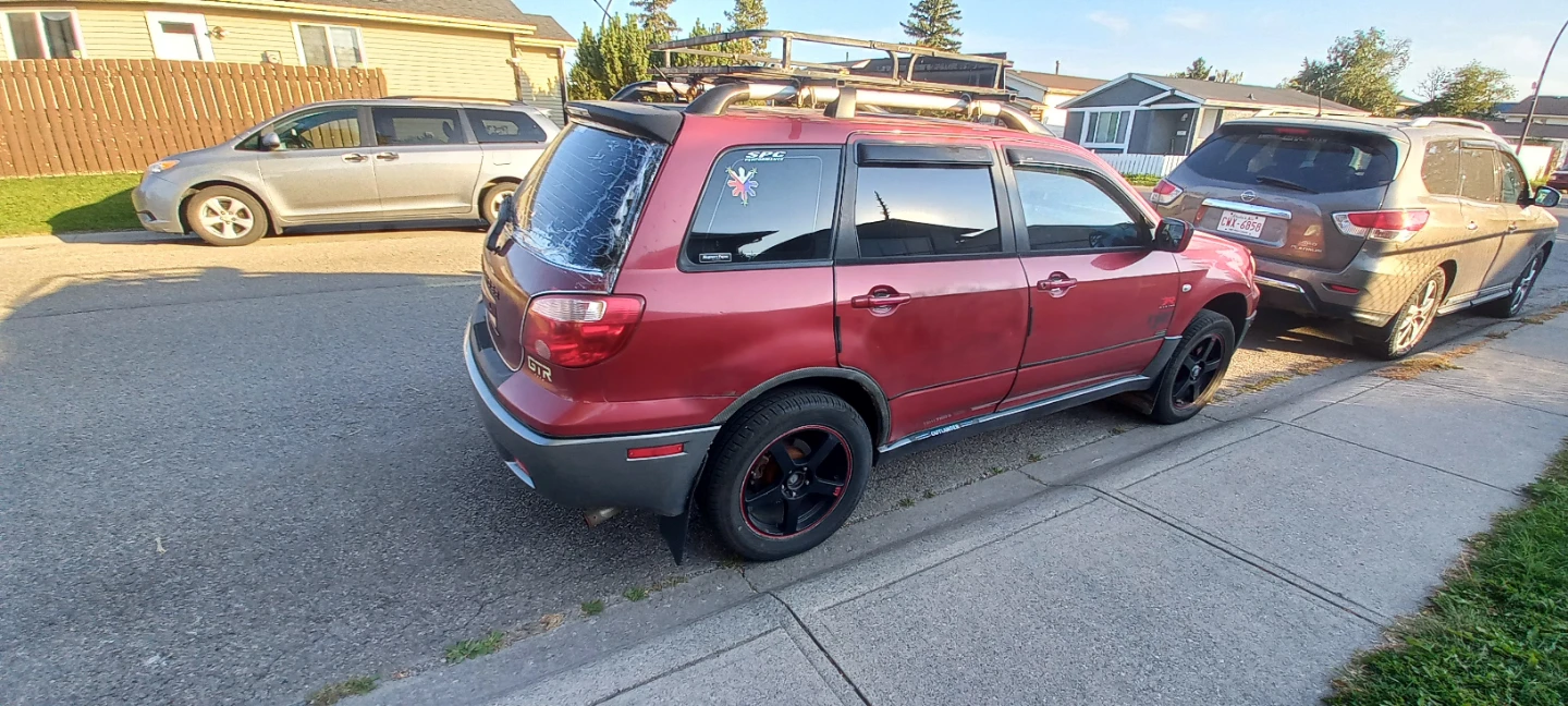 Red Mitsubishi Outlander SUV with Roof Rack - photo 4