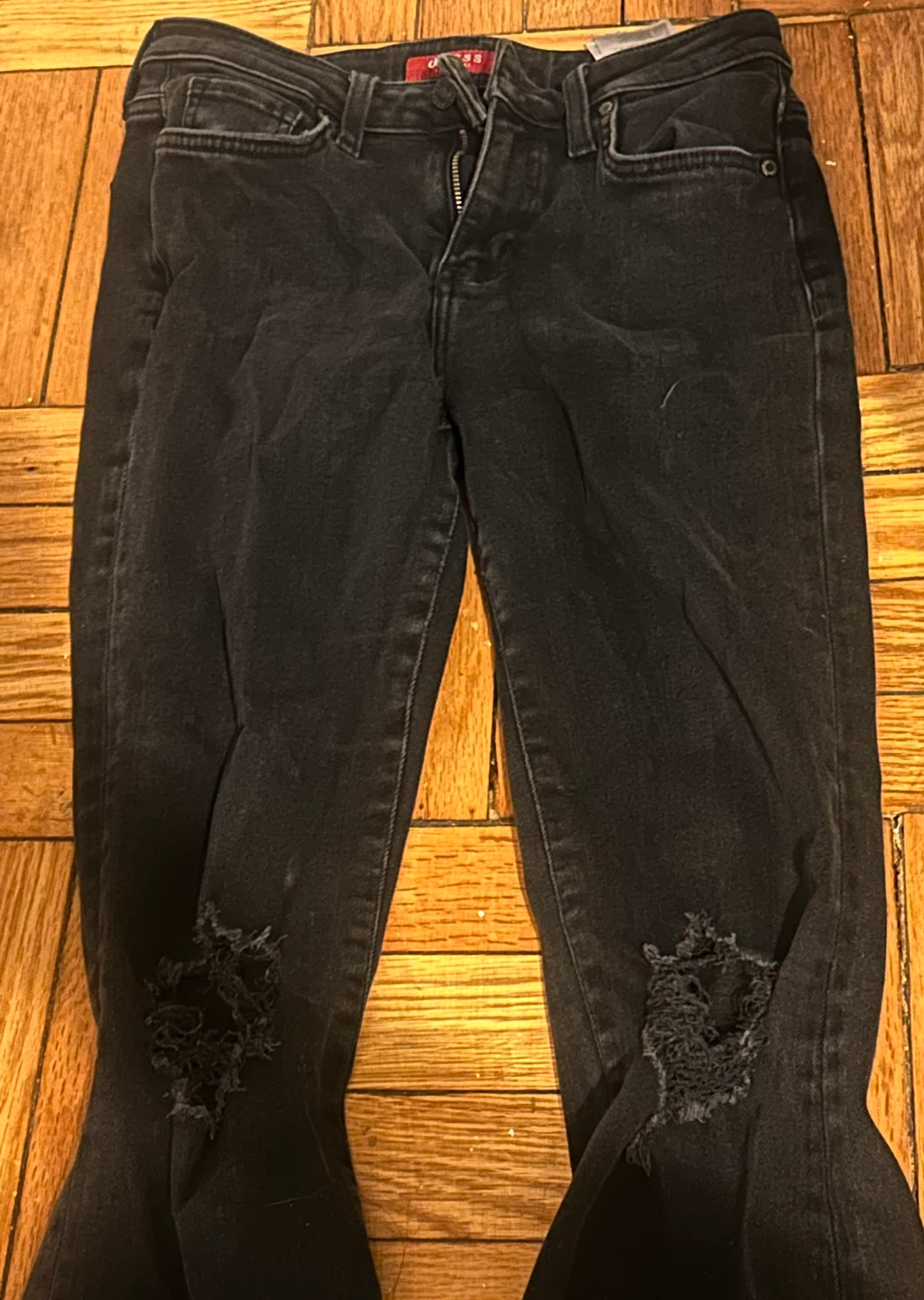 Flared Black Guess Jeans with Ripped Knees