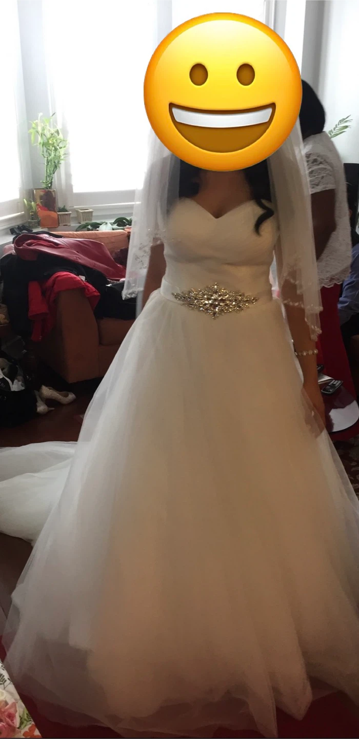 White wedding dress with beaded belt and veil