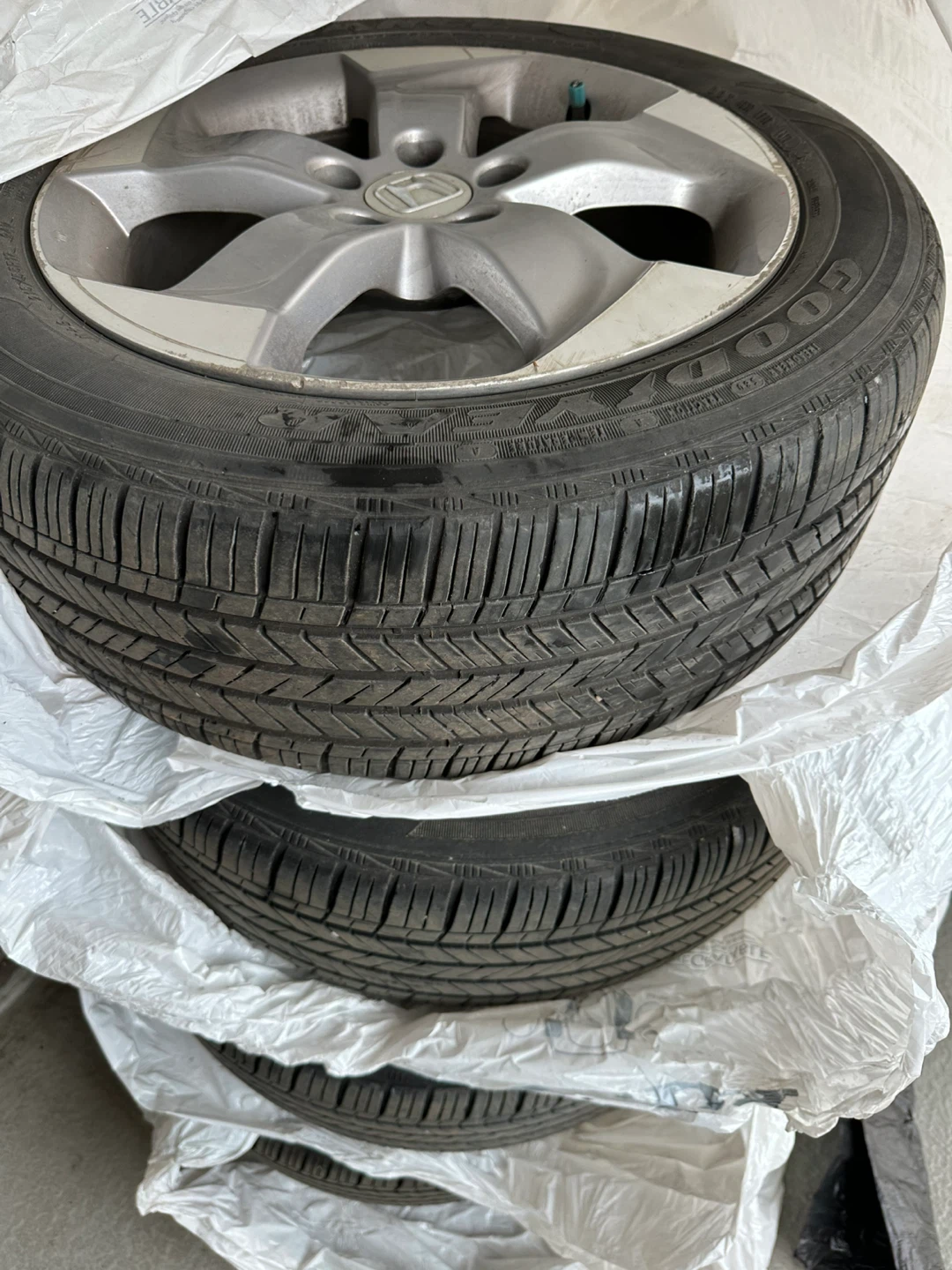 Used 4 Goodyear All season, 216/55R17with Rims(Ad up= Available)