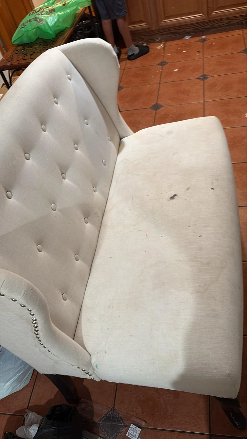 Cream Upholstered Loveseat with Studs