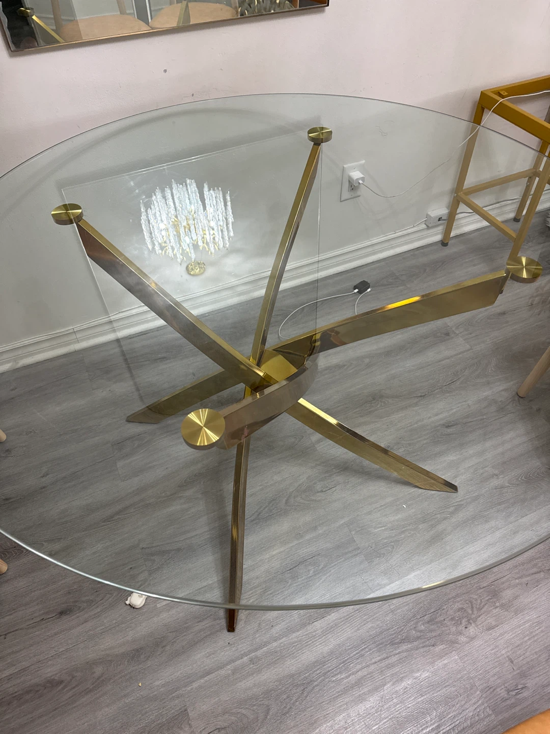 Glass top dining table with gold base