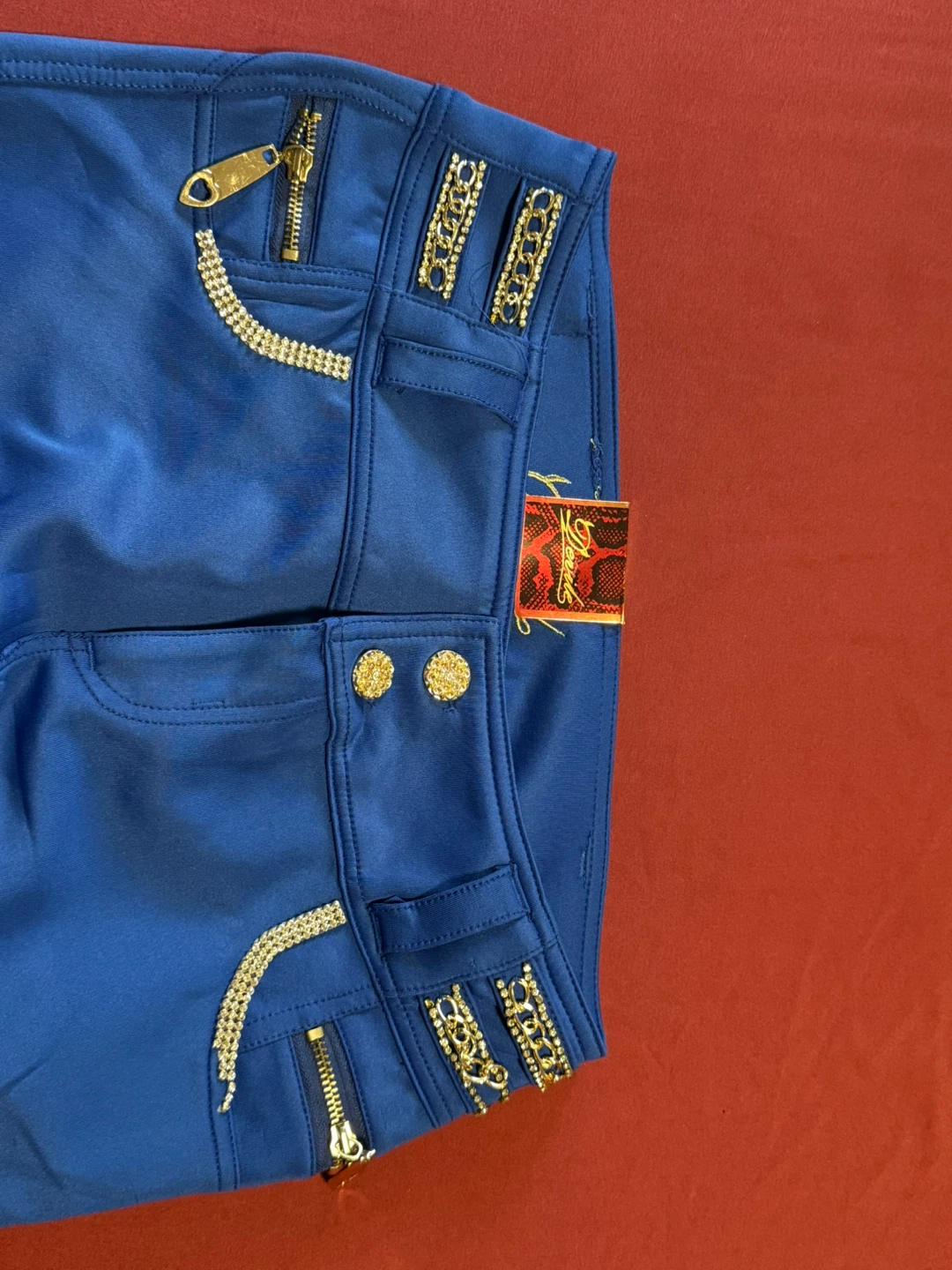 Blue pants with gold accents and rhinestones