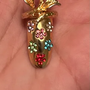 Gold-tone nail with Rhinestone Flowers