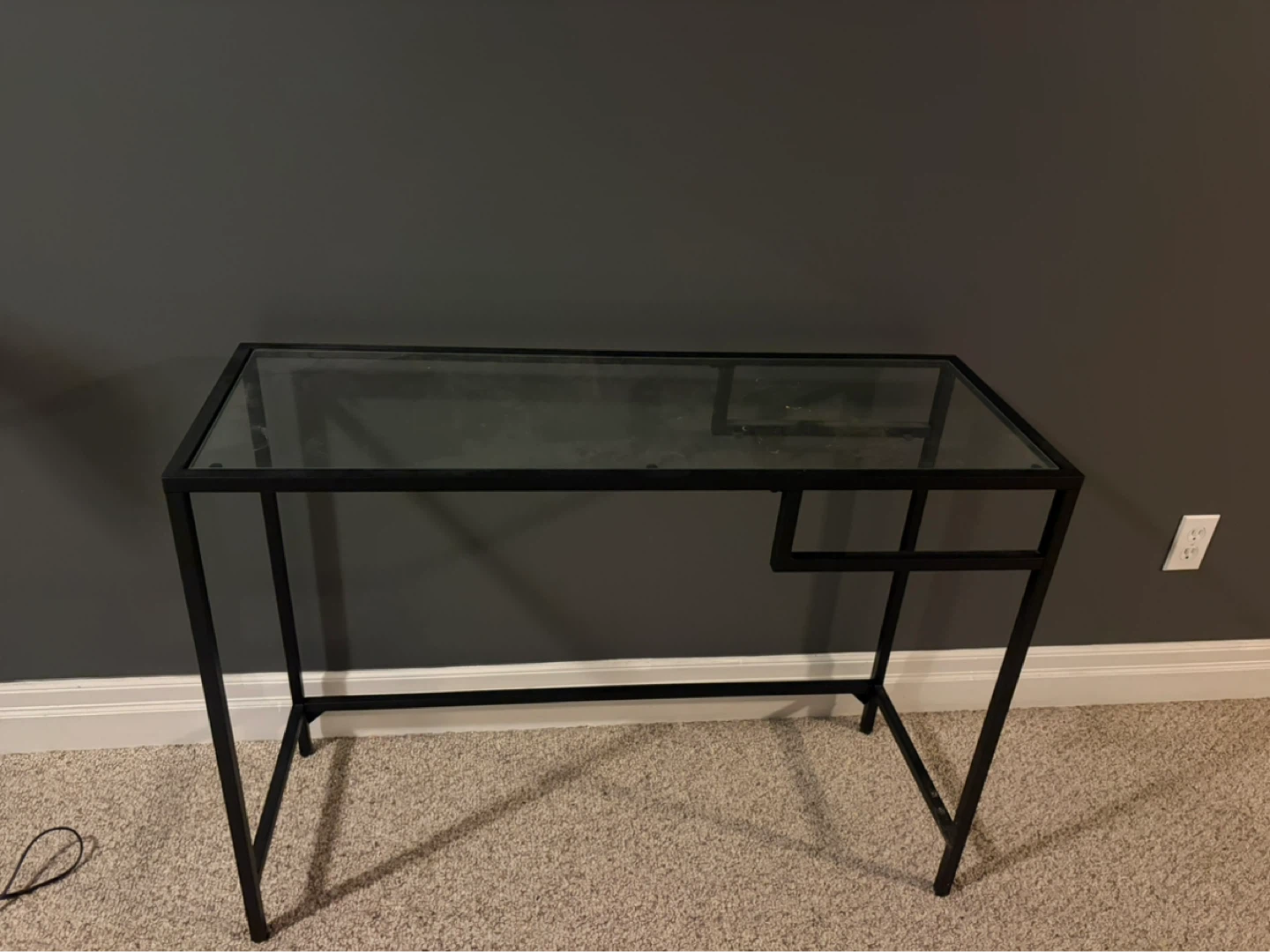 Glass top desk with black metal frame