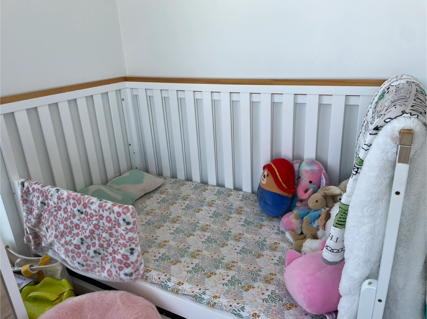 White Baby Crib with Wooden Accents