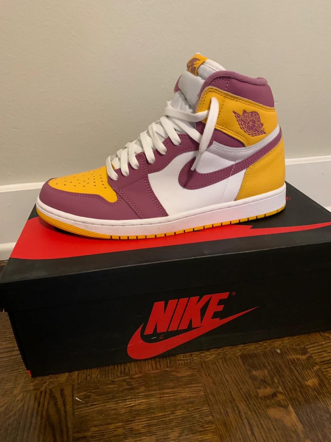 Nike Air Jordan 1 "University Gold" High Top Sneakers