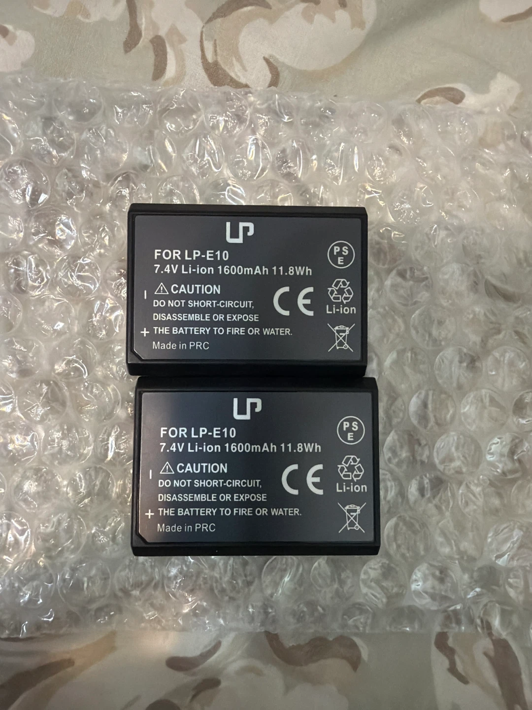 2x LP-E10 Batteries and USB Cable