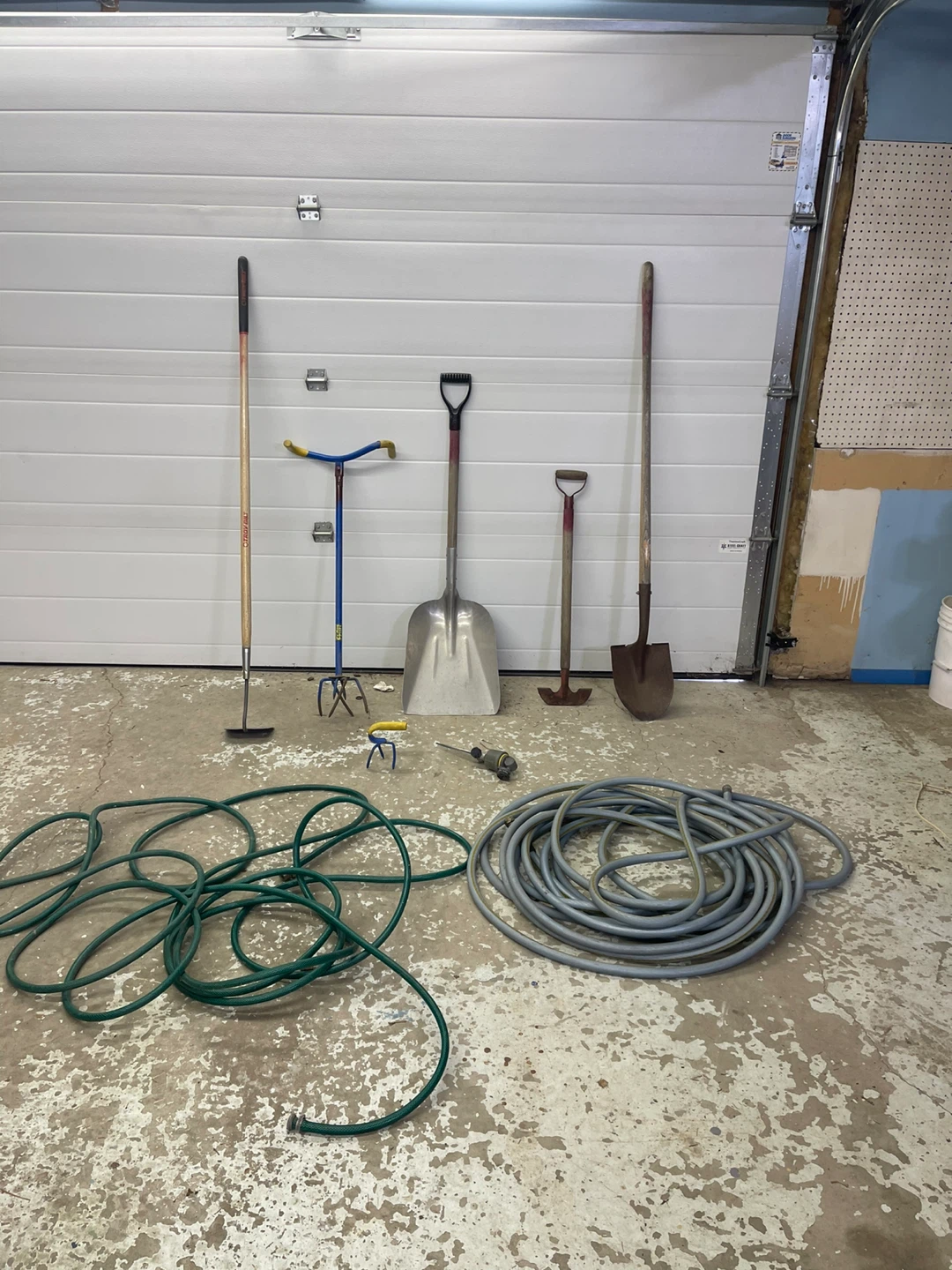 Gardening Tool Assortment: Shovels, Hoes, and Hoses