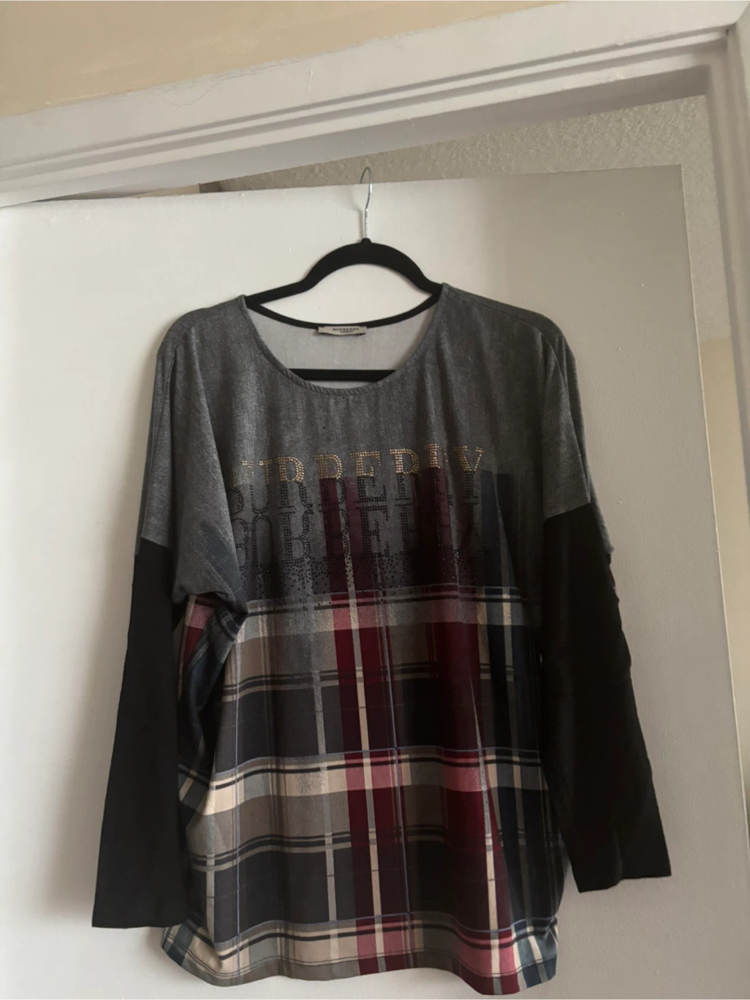 Sweater with plaid sleeves