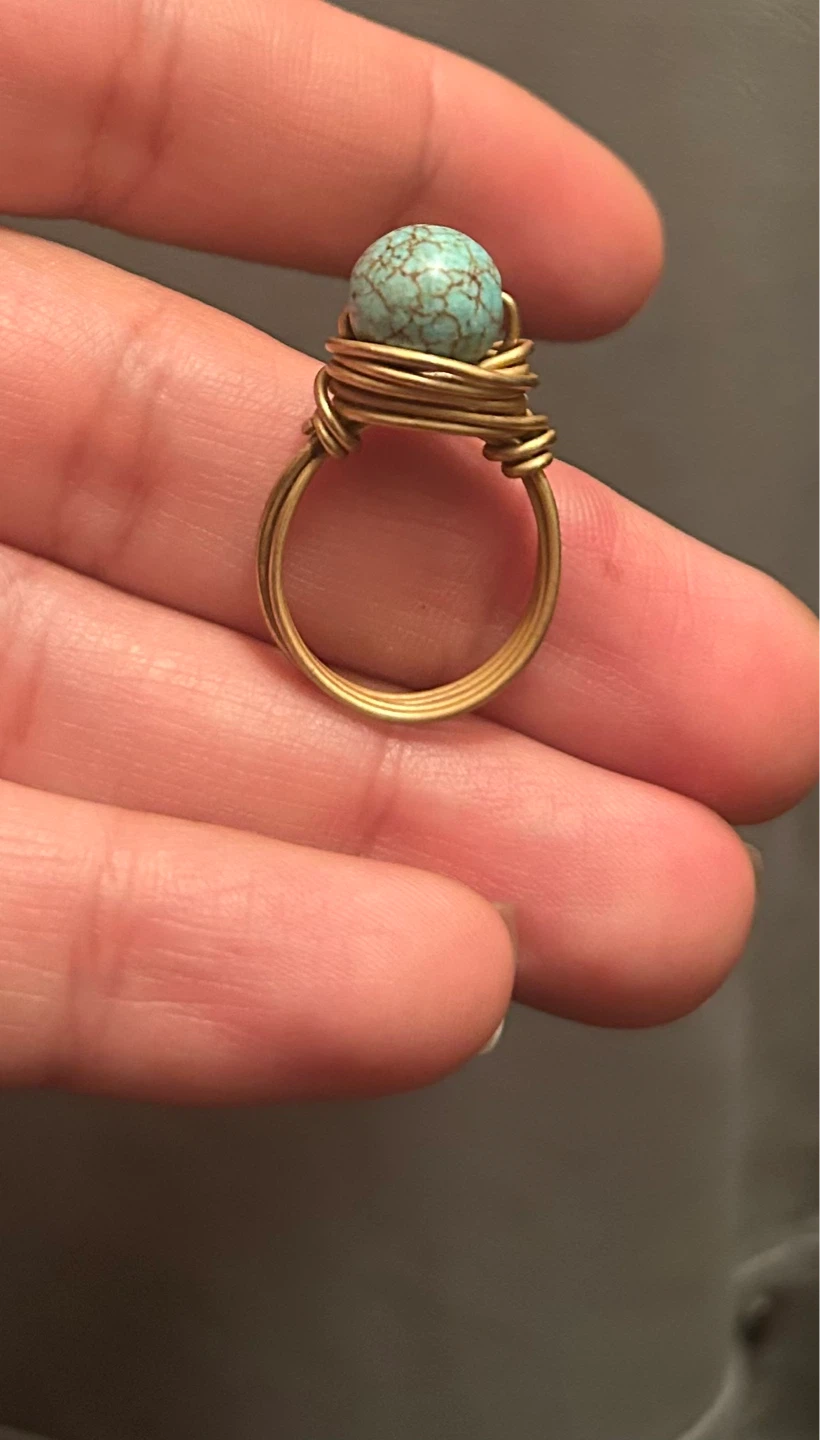 Gold wire-wrapped ring with turquoise stone