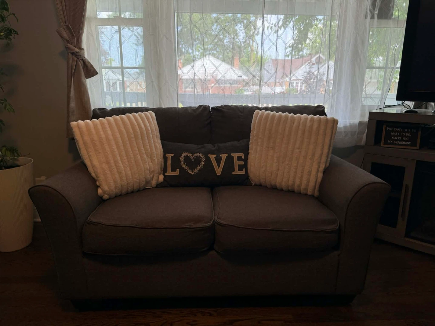 Brown Loveseat with Decorative Pillows