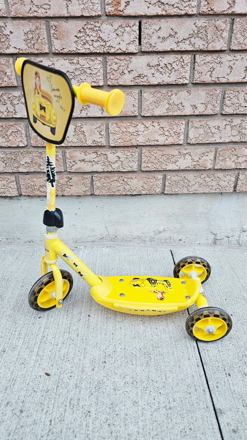 Yellow 3-Wheel Scooter with Car Graphic