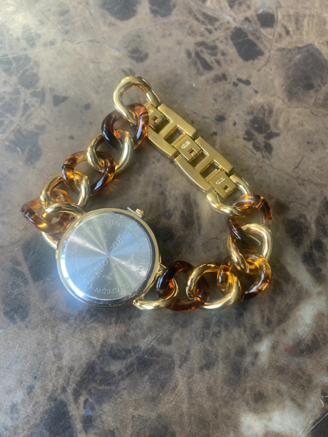 Gold-tone women's watch with tortoise chain - photo 2