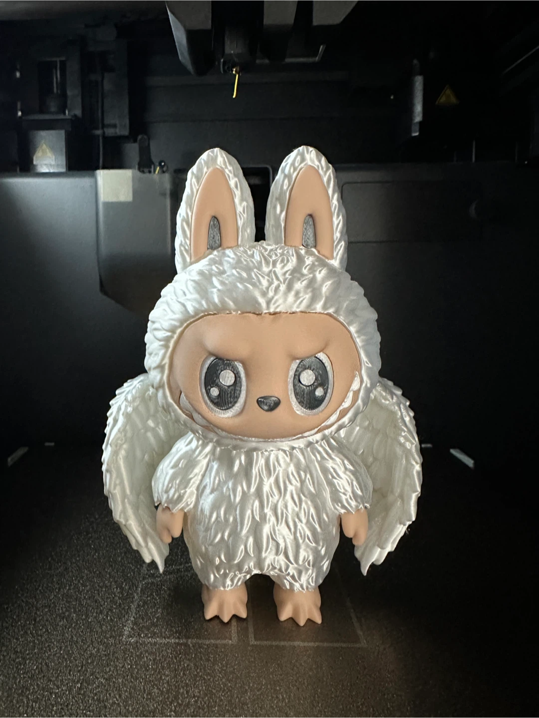 White Fluffy Winged Creature Figure
