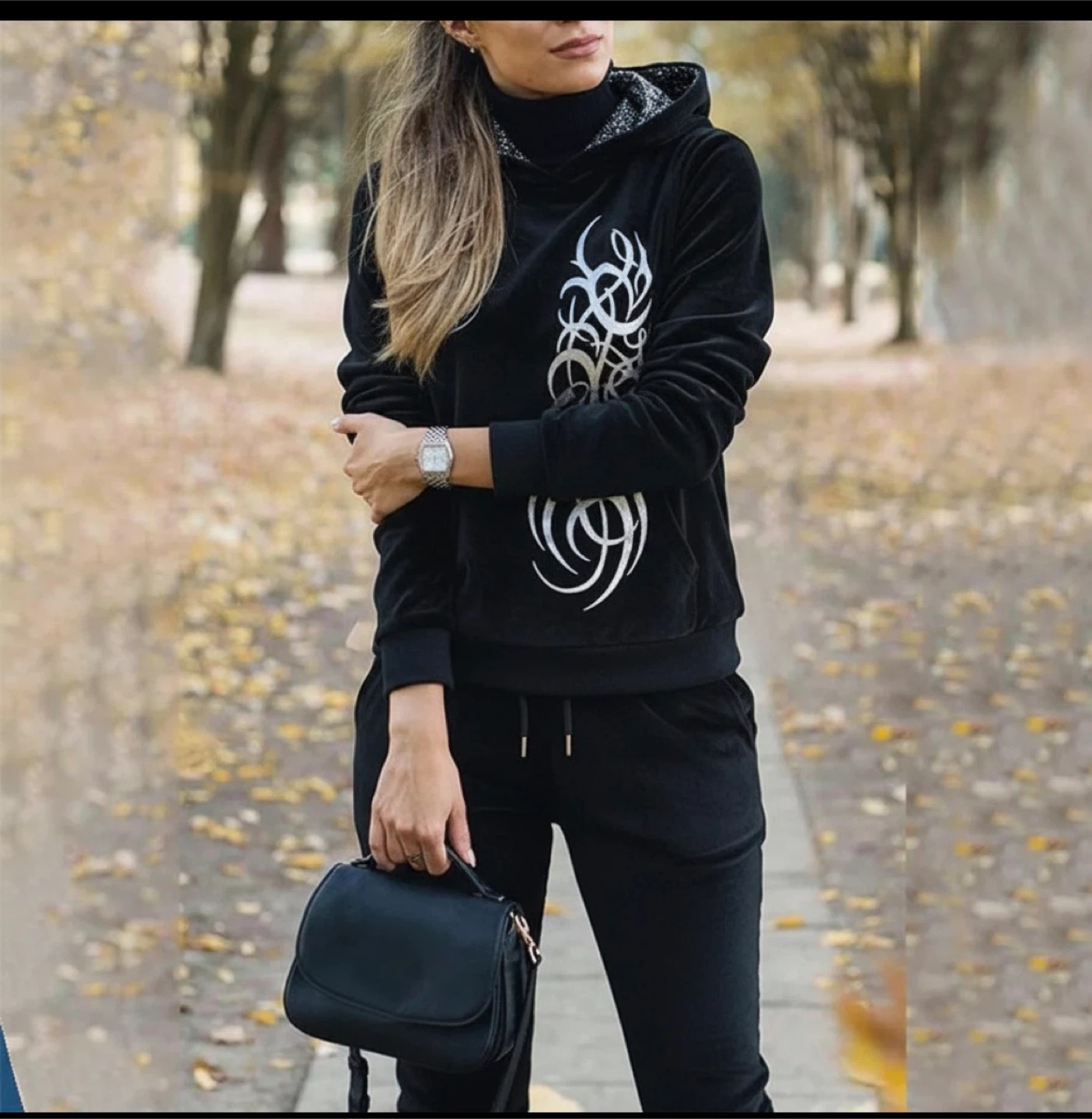 black velour tracksuit set with silver graphic accents