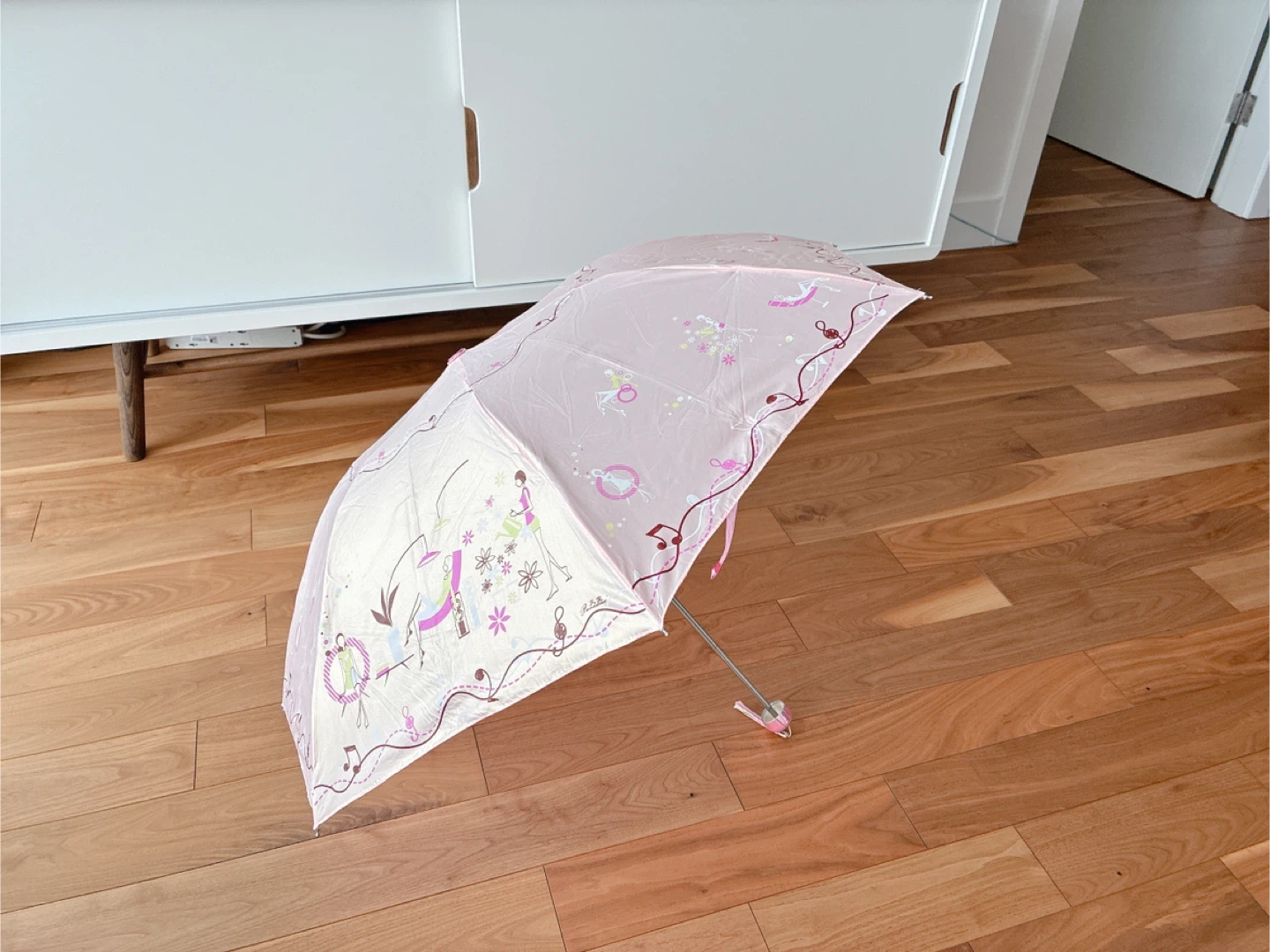 Pink umbrella with decorative print