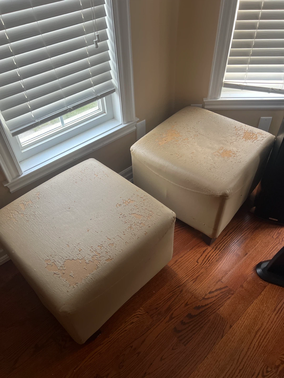 Two beige square ottomans