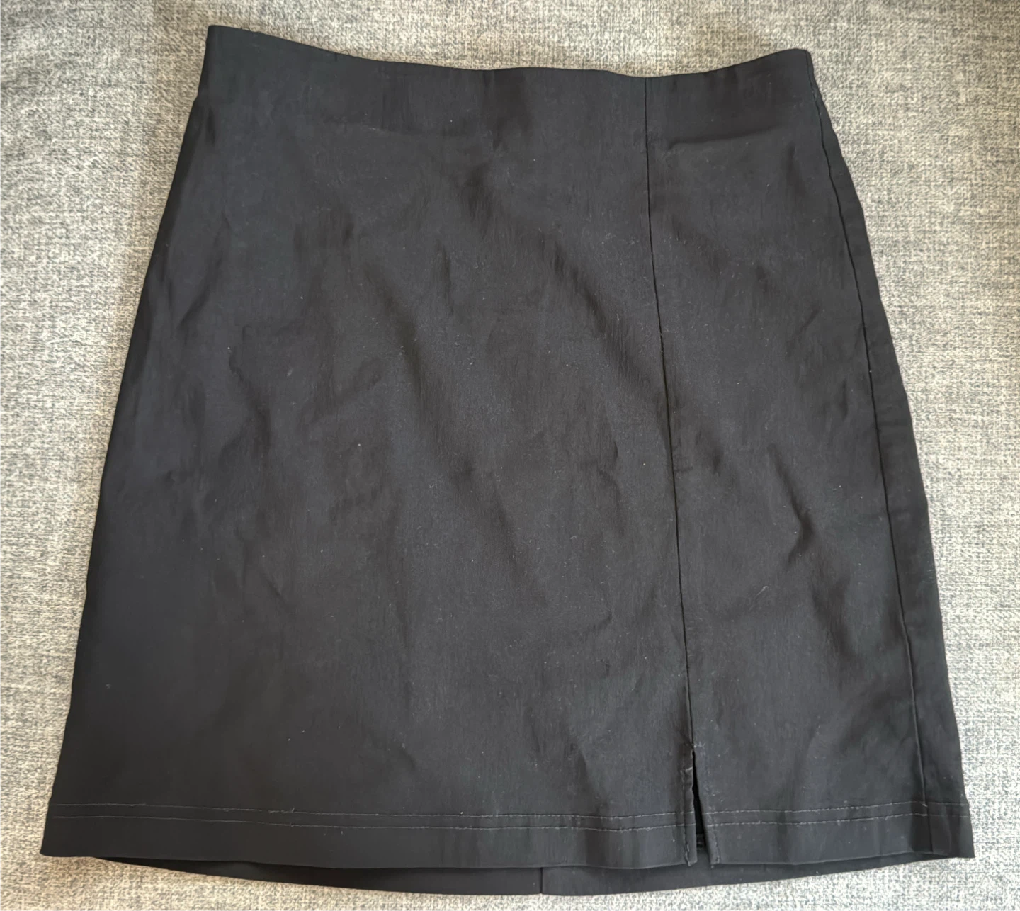 Black mini skirt with slit